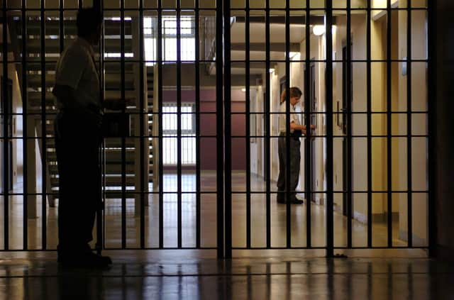 Prison Guards make last minute checks to the Woman's wing.