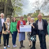 Left to right: John Liggins, Maggie Garton, Clare Sawdon, Helen Fitzpatrick, Christine Cross and Terry Liggins presenting the cheque to Hayley and Alison, Macmillan volunteers. Photo supplied