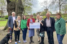 Left to right: John Liggins, Maggie Garton, Clare Sawdon, Helen Fitzpatrick, Christine Cross and Terry Liggins presenting the cheque to Hayley and Alison, Macmillan volunteers. Photo supplied