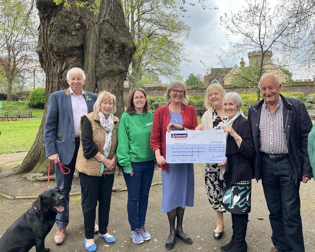 Left to right: John Liggins, Maggie Garton, Clare Sawdon, Helen Fitzpatrick, Christine Cross and Terry Liggins presenting the cheque to Hayley and Alison, Macmillan volunteers. Photo supplied