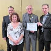 Warwick Rotary President Keith Talbot (centre) presents the Meritorious Award to Dr Librowski and his team: from left Dawid Kozlowski, Alex Willson, and far right Iza Topolinska. Photo supplied