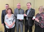 Warwick Rotary President Keith Talbot (centre) presents the Meritorious Award to Dr Librowski and his team: from left Dawid Kozlowski, Alex Willson, and far right Iza Topolinska. Photo supplied