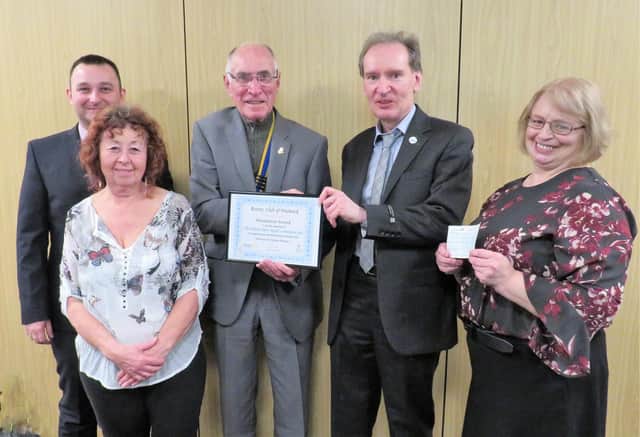Warwick Rotary President Keith Talbot (centre) presents the Meritorious Award to Dr Librowski and his team: from left Dawid Kozlowski, Alex Willson, and far right Iza Topolinska. Photo supplied