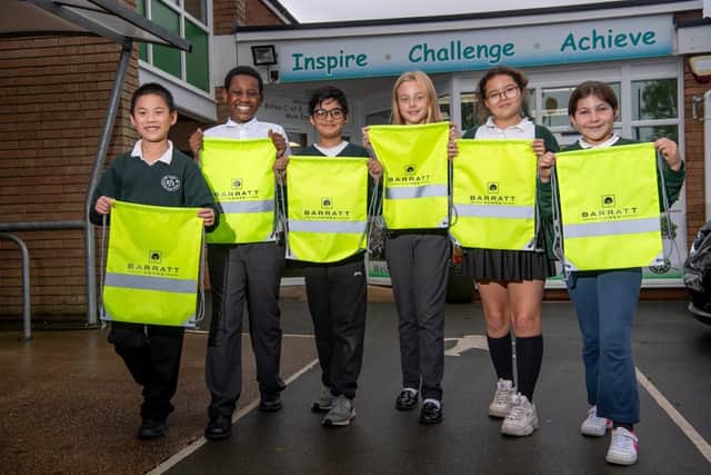 Pupils from Bilton C of E Junior School receiving their hi-vis kit bags from Barratt Homes.