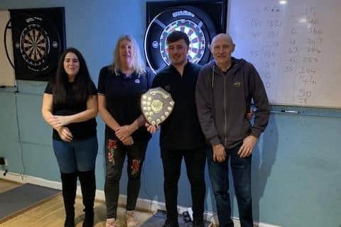Overall winner Charlie Symons and L-R Janine Gough, Cheryl Douglas, Charlie Symons and Carl Green, winner and runner up of the Joe Spooner darts tournament 2023.