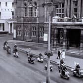 A photo taken in the late 1950s when the Vespa Club of Britain held a rally in Leamington and rode down the Parade past the Town Hall
