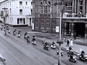A photo taken in the late 1950s when the Vespa Club of Britain held a rally in Leamington and rode down the Parade past the Town Hall