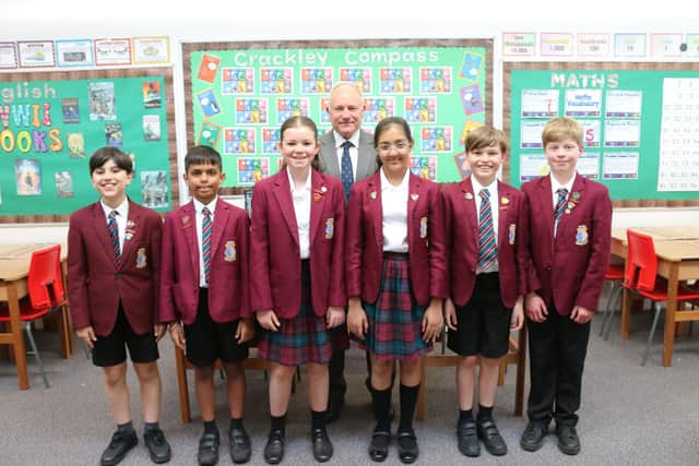 Headmaster, Rob Duigan with pupils from the school