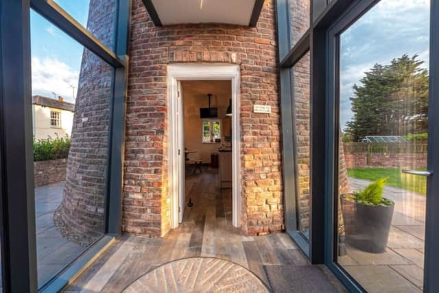 Entrance is gained via a door in the atrium that connects the windmill and annex. (Picture: Reeds Rains)