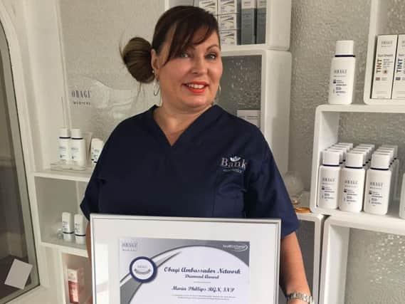 Maria Phillips with her award