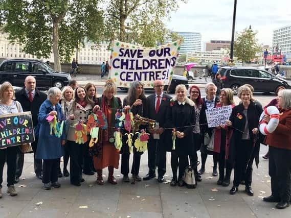 Campaigners hoping to save Warwickshire's children's centres protesting near the Houses of Parliament after being invited by Warwick and Leamington MP Matt Western