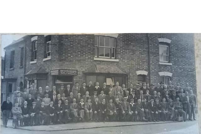 Members of the United Railwaymen's Club line up for the camera