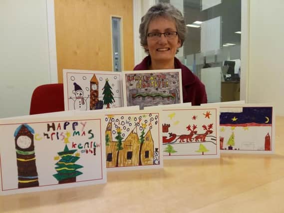 Kenilworth mayor Cllr Kate Dickson with the winning designs. The designers of the cards were: Back row from left - Chae-Yun Lee, Callum Smith. Front row from left - Emily, Isla Harris, Ellis Starkey, Aman Curtis