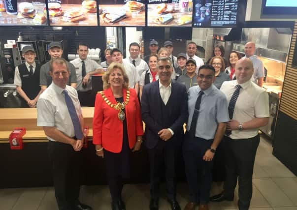 Leamington Mayor Caroline Evetts with Ismail Anilmis with staff at the McDonald's on the Parade in Leamington.