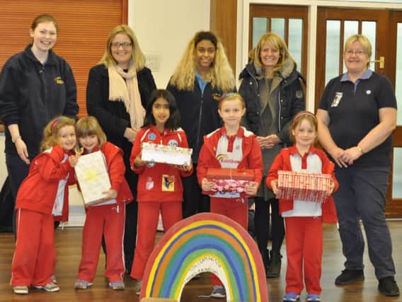 Back row from left: Megan Levis, Lianne Kirkman, Grace Whitely, a volunteer from Helping Hands, and Julie Brown. Front row from left: Beatrice Guest, Flora Fulton, Anais Sahota, Chloe Dempsey, Isabel Wales