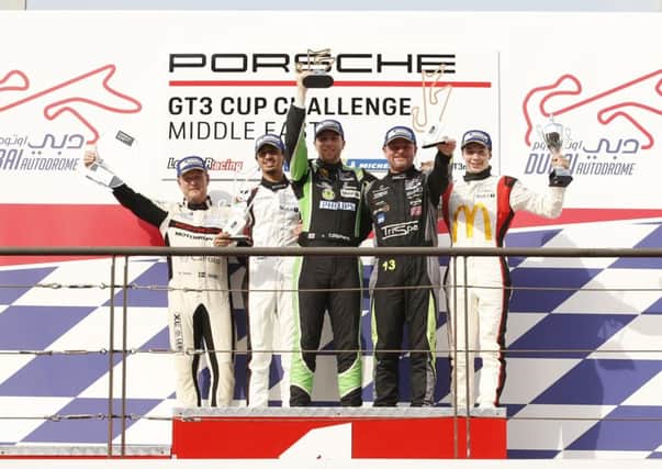 Tom Oliphant takes centre stage after a superb victory in the Porsche GT3 Cup Challenge Middle East. Picture: Porsche Middle East