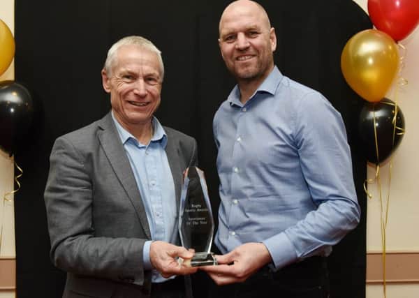 The 2016 Sportsman of the Year, triathlete Mike Smallwood receiving his award from the special guest at last year's ceremony, footballer David Busst