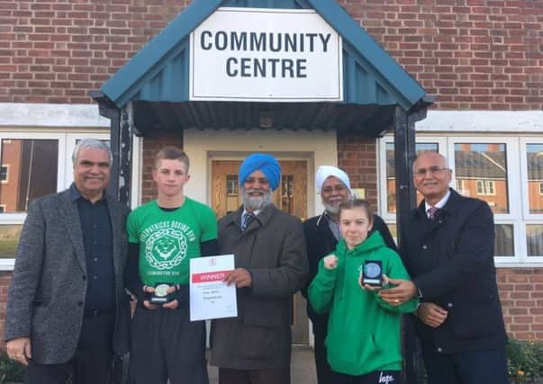 Bhajan Aulak, Shalbinder Singh Malle, Tika S Bhangal and Bob Aujla from the Sikh Community Centre with Fitzpatricks Gym boxers Nick Leahy and Leah Gunton. Picture submitted