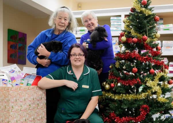 Heathcote Veterinary Centres Amanda Cousins, centre, with, left, Sandy Soinne, from Cats Protection, and, right, Wendy Shear from South and East Warwickshire RSPCA