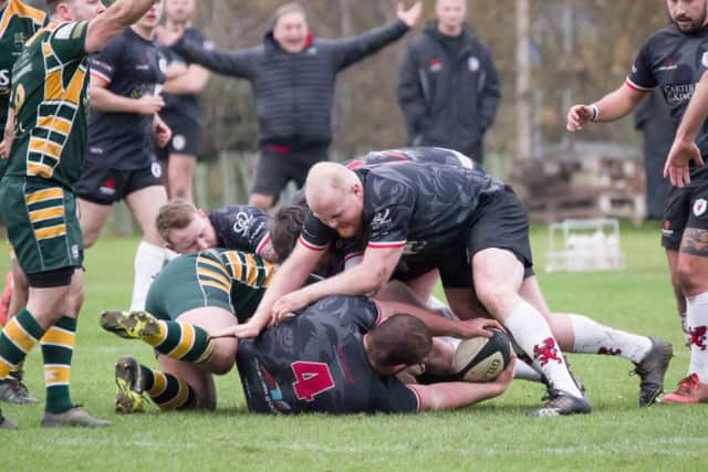 Sam Herrington on the ground, with James Wilsher-Aiken