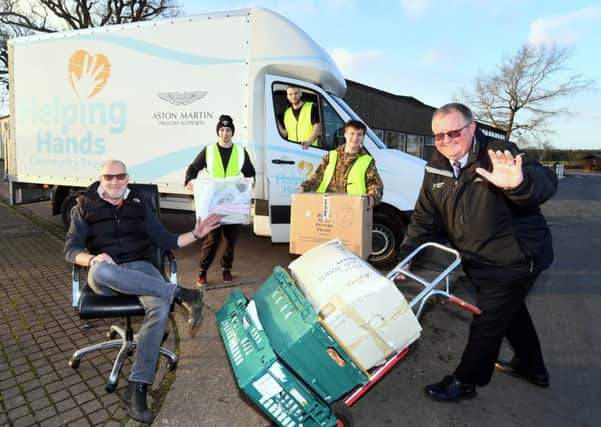 Richard Wood is pictured helping the charity move into its new home at Stoneleigh Park with, from left to right, Bertie, Sean, Callum and Milo, from Helping Hands Community Project.
