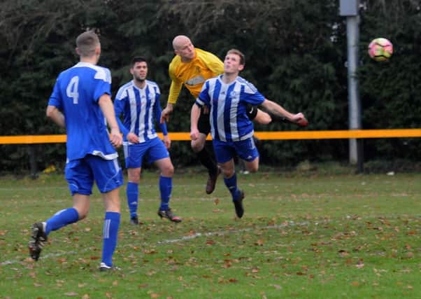 Luke Cole heads home Racing Club's opener from Henry Leaver's cross. Picture: Morris Troughton