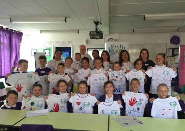 Pupils making t-shirts for the Let's be Friends project.