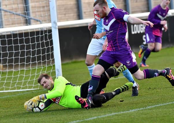 Niall Cooper saves in Saturday's win at Loughborough   PICTURES BY MARTIN PULLEY