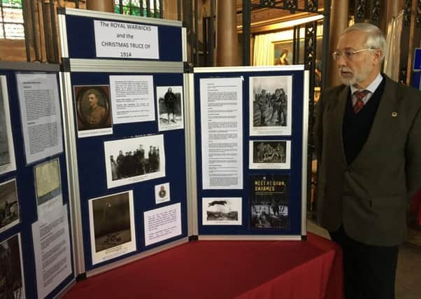 Local military historian Alan Reed with the new display at St Mary's Church in Warwick.
