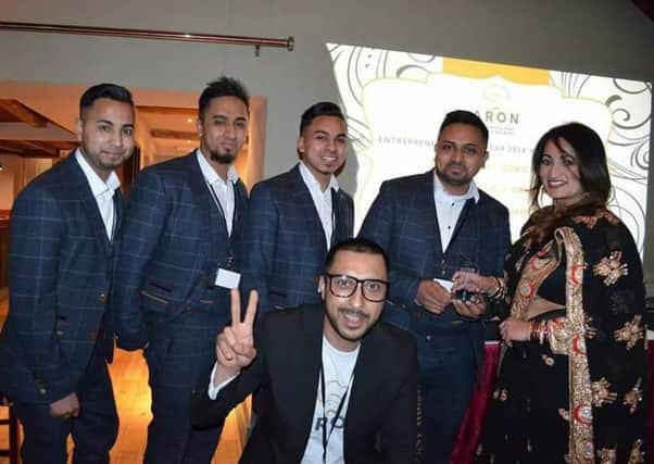 Millennium Balti owner Mohammed Abdul Ahad (pictured with his brothers in matching suits) receives his Asian Restaurant Owners Network award from award-winning chef Sarah Ali Choudury and organiser Rehan Uddin (front) o21hLAVvjZomhGprvQx6