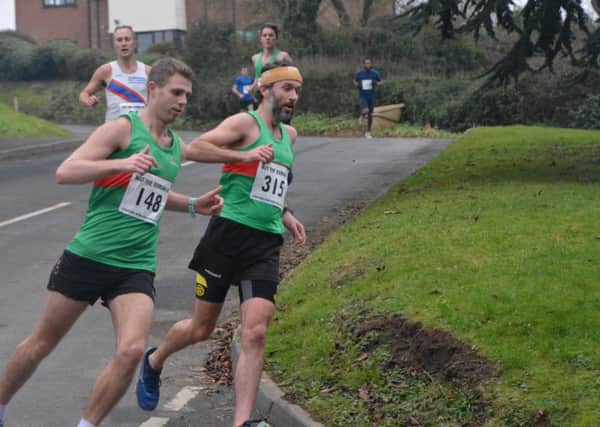 Spa Striders' Paul Edwards and Chris McKeown battle it out. Picture: Nigel Fox