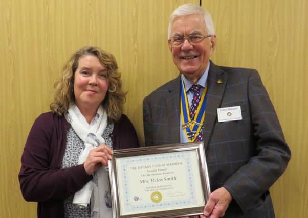 Helen Smith, founder of Evelyn's Gift with Warwick Rotary Club President John Hibben.