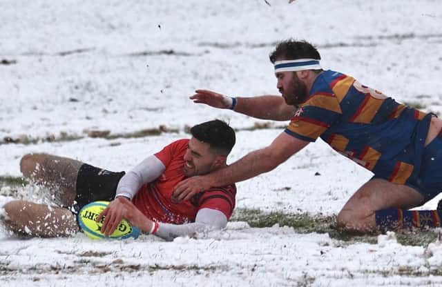 Lee Lightowler slides through the snow for a Newbold try at Old Halesonians   PICTURES BY STEVE SMITH
