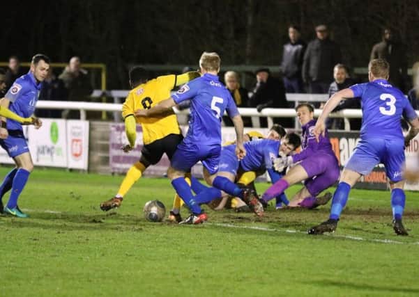 Daniel Udoh fires home to put Brakes into an early lead against Gainsborough Trinity. Pictures: Tim Nunan