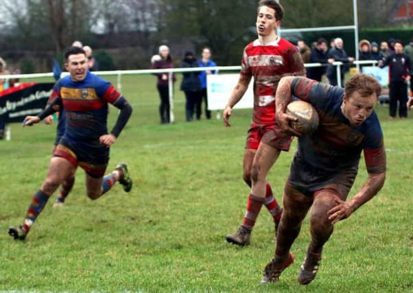 Gareth Shuttleworth races in for Leamington's final try against Nuneaton Old Edwardians. Picture: Gina Ruyssevelt