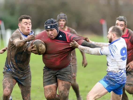 Ben Nuttall in Saturday's muddy game against second-placed Peterborough Lions