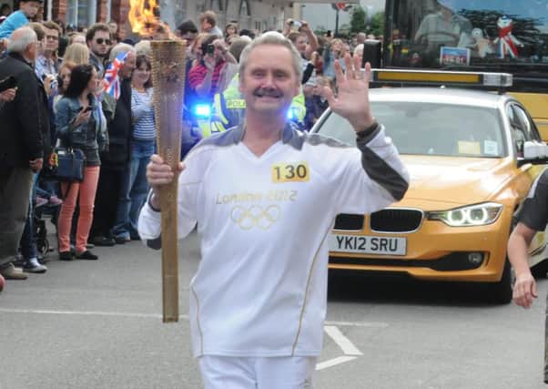 Peter Frazier with the Olympic Torch ahead of London 2012.