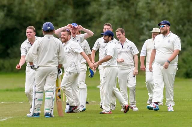 Newbold CC players celebrating a wicket in one of their games last season