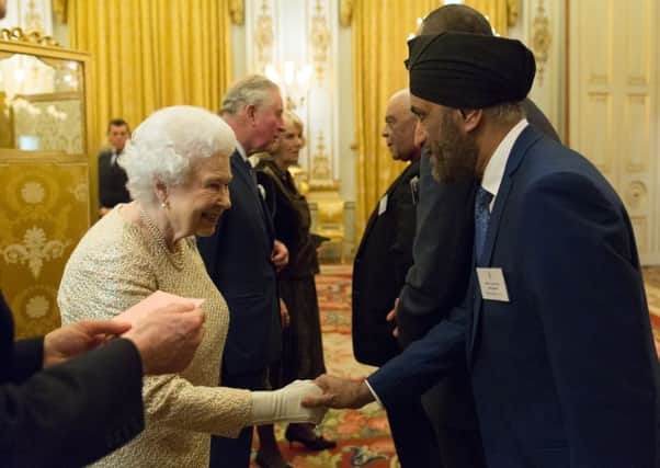 Cllr Parminder Singh Birdi meets the Queen. Photo British Ceremonial Arts Ltd.