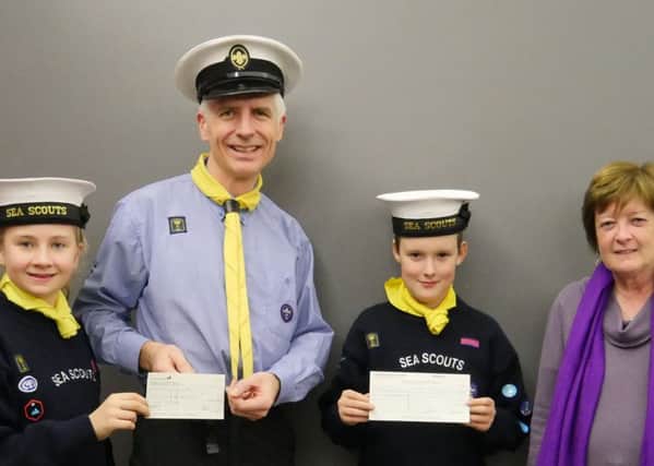 Left to Right: Abigail George (aged 10),  Nick George (Assistant Scout Leader) Peter Hoerl (aged 11) and Claire Darlington (Chair of Village Voices).