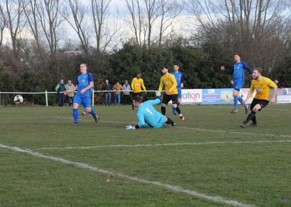 Rich Powell slots home Racing Club's second. Pictures: Morris Troughton