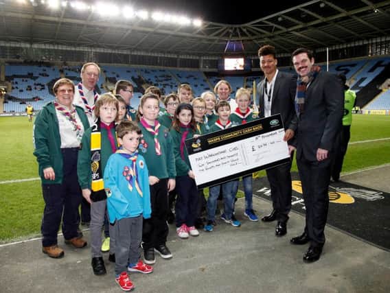 Warwickshire Scouts being presented with their 2,000 cheque by Wasps players Guy Armitage and Alex Rieder