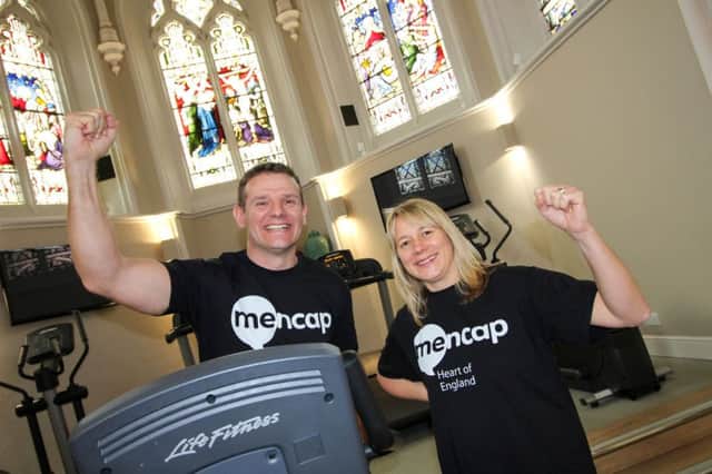 Jonathan Davis in the gym with Heart of England Mencaps Fundraising Manager Cath Errington.