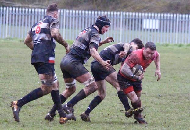 Phil Reed escapes the clutches of opponents Bridgnorth at Parkfield Road on Saturday   PICTURES BY STEVE SMITH