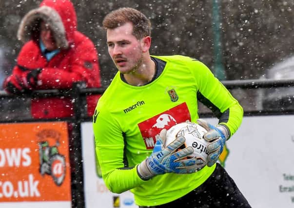 Goalkeeper Niall Cooper peers through Saturday's snow at Coleshill   PICTURES BY MARTIN PULLEY