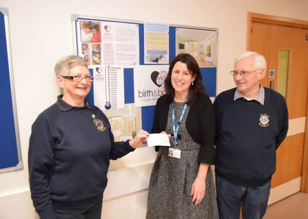 Warwick Lions Club President Pauline Fanti with her partner Jon Dodd handing over the donation to Sarah Noble, Head of Midwifery.