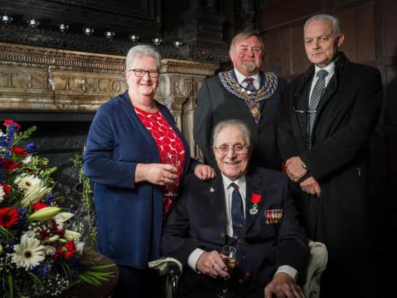 Bernard Stone (bottom) after receiving the Legion d'honneur with his second wife Barbara (left), then-mayor Cllr Richard Davies, and French Consul Robert Mille