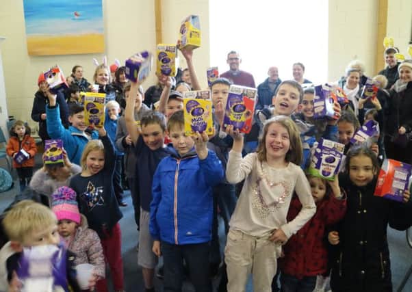 Children with their Easter egg prizes after the Easter egg hunt.