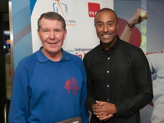 David Phillips (left) with former Olympic hurdler Colin Jackson, this year's non-running captain of Team Phillips
