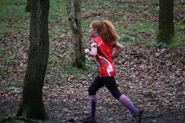 Junior Florence Lunn, running through the woods at Brereton Spurs on Day 2 of JK2018